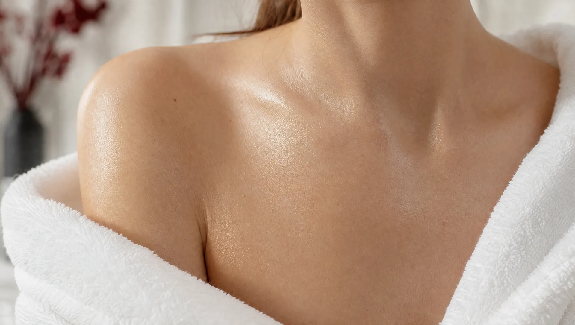 Close-up of the neck and collarbone — the area neck and décolleté biorevitalization is planned around at Activate Beauty in Miami.