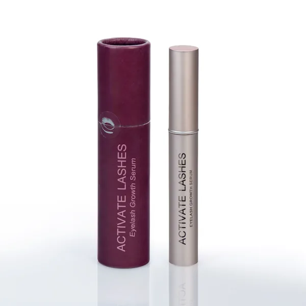 Activate Lashes eyelash serum in its burgundy tube next to the beige serum bottle.