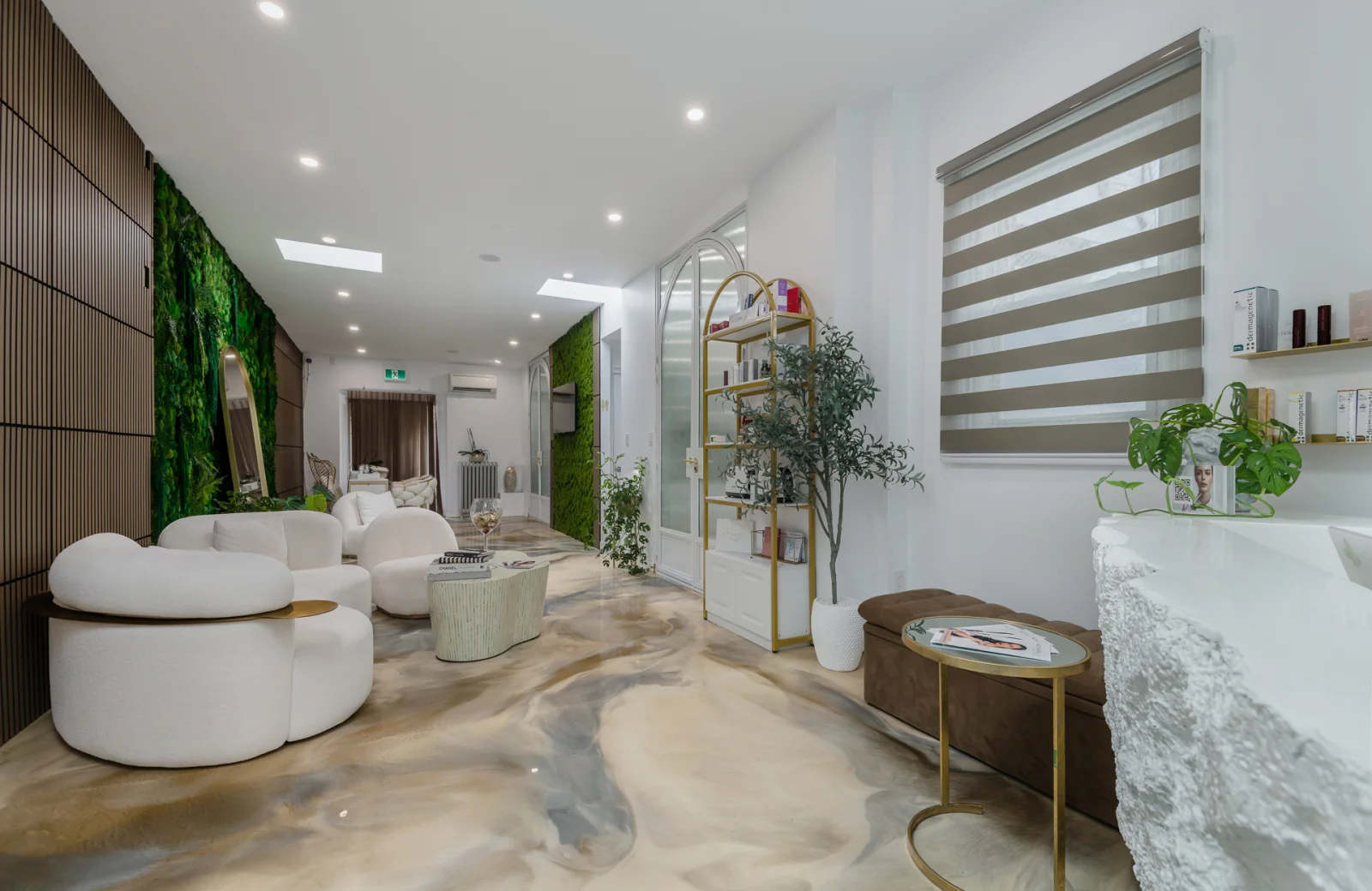 The Activate Beauty studio in North Miami Beach — marble floor, signature moss wall and bouclé lounge